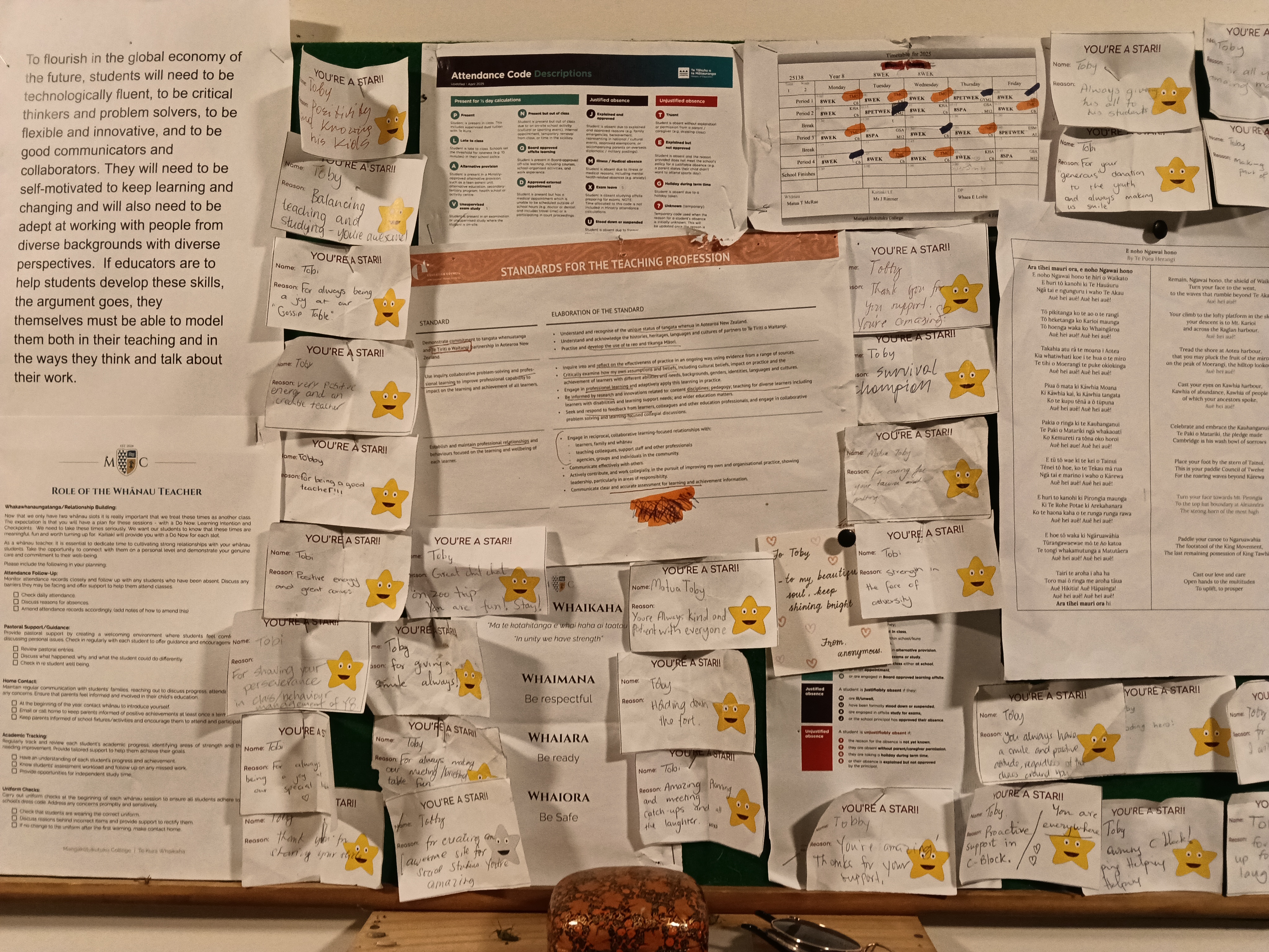 Commendation wall covered in You're a Star certificates from other teachers
